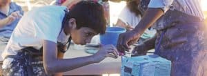 Refugee teens creating art with Say It with Clay
