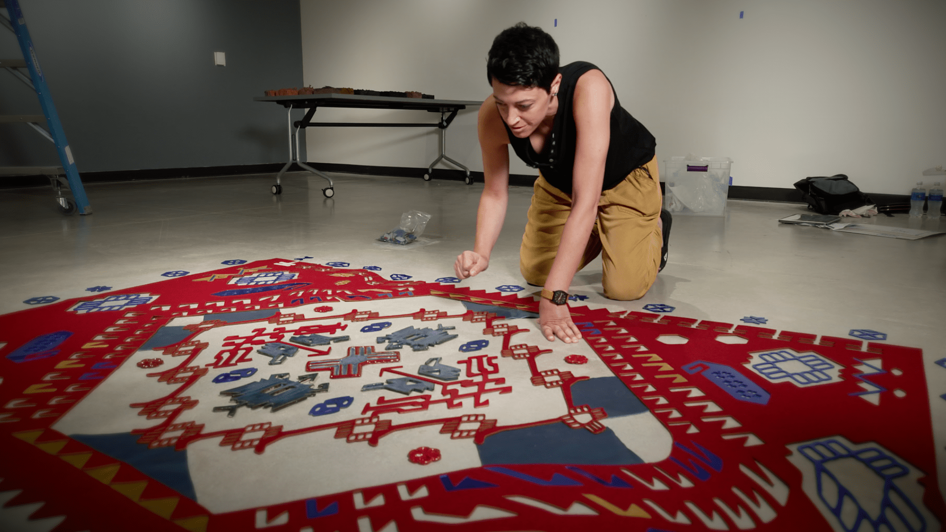 Jessica Sperandio assembling art at the Stockton University Art Gallery