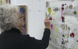 Joan Snyder working on her art